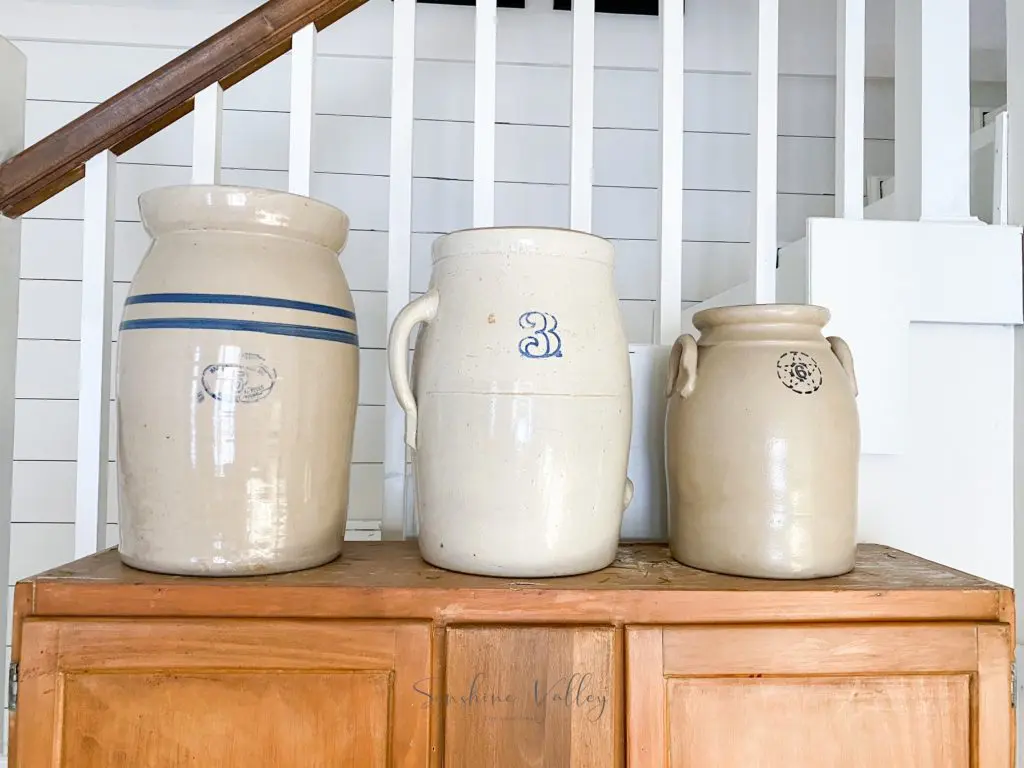 vintage crocks used as decor in dining room simple living